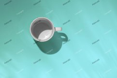 Empty tea cup on blue paper background. Coffee mug Product Image 1
