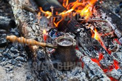 Metal cezve with hot coffee on a bonfire. Product Image 1