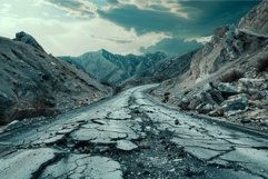 Deserted mountain road with deep cracks and dramatic sky Product Image 1