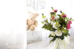 Flowers in the vase on wooden floor with concrete wall Product Image 1