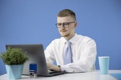 Handsome man dressed in classic shirt with blue tie Product Image 1