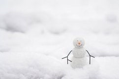 A Happy Snowman on the street staying in the snow Product Image 1