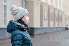 woman wears medical mask in the empty street. Product Image 1