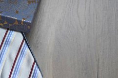 Roll up necktie on the table, a box of a present Product Image 1