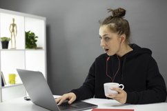 Beautiful hipster girl freelancer working at laptop Product Image 1