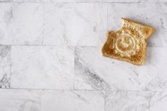 Topview flat lay of working table with toast bread. Product Image 1
