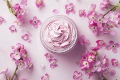 Pink cosmetic cream surrounded by small pink flowers Product Image 1