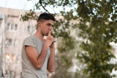 Young caucasian man walks in a park Product Image 1