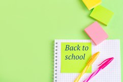 School and office supplies on office table, green background Product Image 1