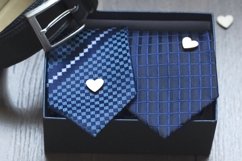 Roll up necktie on the table, a box of a present Product Image 1