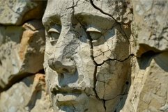 Cracked clay sculpture of a face Product Image 1