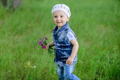 Cute baby girl on a walk in the Park Product Image 1