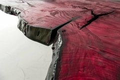 Polished live edge wooden slab with a crack filled with epox Product Image 1