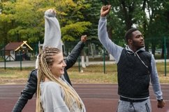 African american man stretching with a group of friends Product Image 1