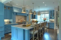 Modern blue kitchen featuring a large island with seating Product Image 1