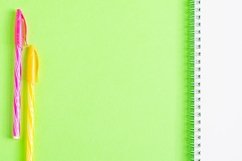 School and office supplies on office table, green background Product Image 1