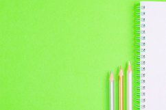 School and office supplies on office table, green background Product Image 1