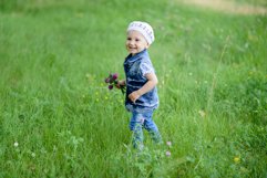 Cute baby girl on a walk in the Park Product Image 1