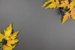 Autumn flat lay with leaves and berries on dark background. Product Image 1