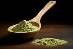 Green matcha powder in wooden spoon Product Image 1
