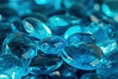 Close-up of glistening blue gemstones with a bokeh effect Product Image 1