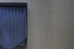 Roll up necktie on a box Product Image 1