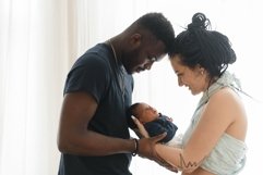 Diverse family standing together in front of the window Product Image 1