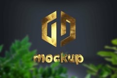 Brass Logo Mockup behind the green leaves Product Image 1