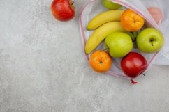 Fresh organic fruits in reusable textile shopping bag. Product Image 1