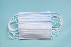 medical masks on blue background with copy space Product Image 1