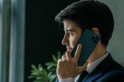 Businessman in suit with mobile phone in hands. Man typing m Product Image 1
