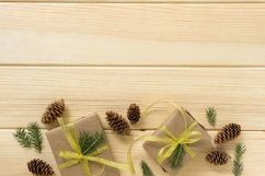 Gift boxes with golden ribbon, fir and cones Product Image 1