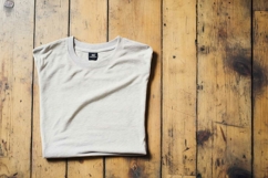 White T-shirt on a wooden background Product Image 1