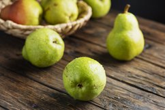 Sweet green pears on the wooden rustic table Product Image 1