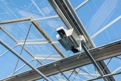 Glass roof with lighting equipment in a modern greenhouse Product Image 1