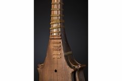 Part ancient Asian stringed musical instrument on black Product Image 1