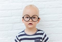 Cute little child with glasses on white background Product Image 1