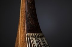 Part ancient Asian stringed musical instrument on black Product Image 1