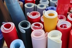 Rolled fabric samples found on a market - background Product Image 1