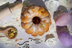 Easter cake with bunny and colored on white wooden table Product Image 1