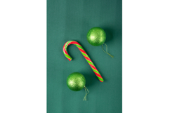 Glittering green baubles hanging and candy cane Product Image 1