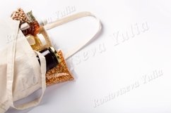 Vegan food supplies in reusable bag on white background Product Image 1