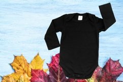 Black Baby Bodysuit Mockup. Long sleeve baby bodysuit on blue wood background