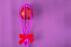 Pink pastry whisk with red bow and isparkling red ball Product Image 1