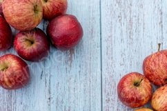 Organic ripe apples on a wooden table Product Image 1
