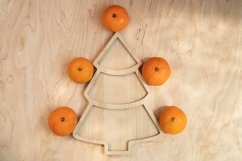 Tangerines around a wooden plate in the form of a herringbon Product Image 1