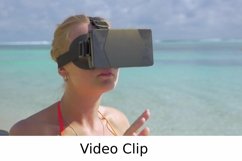 Video: Woman using VR-headset on the beach Product Image 1