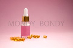 Cosmetic serum in a bottle with a dropper in a pink bottle Product Image 1