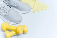 Flat lay shot of Sport equipment on blue background Product Image 1