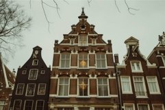 Narrow brick houses standing close together in amsterdam, ne Product Image 1